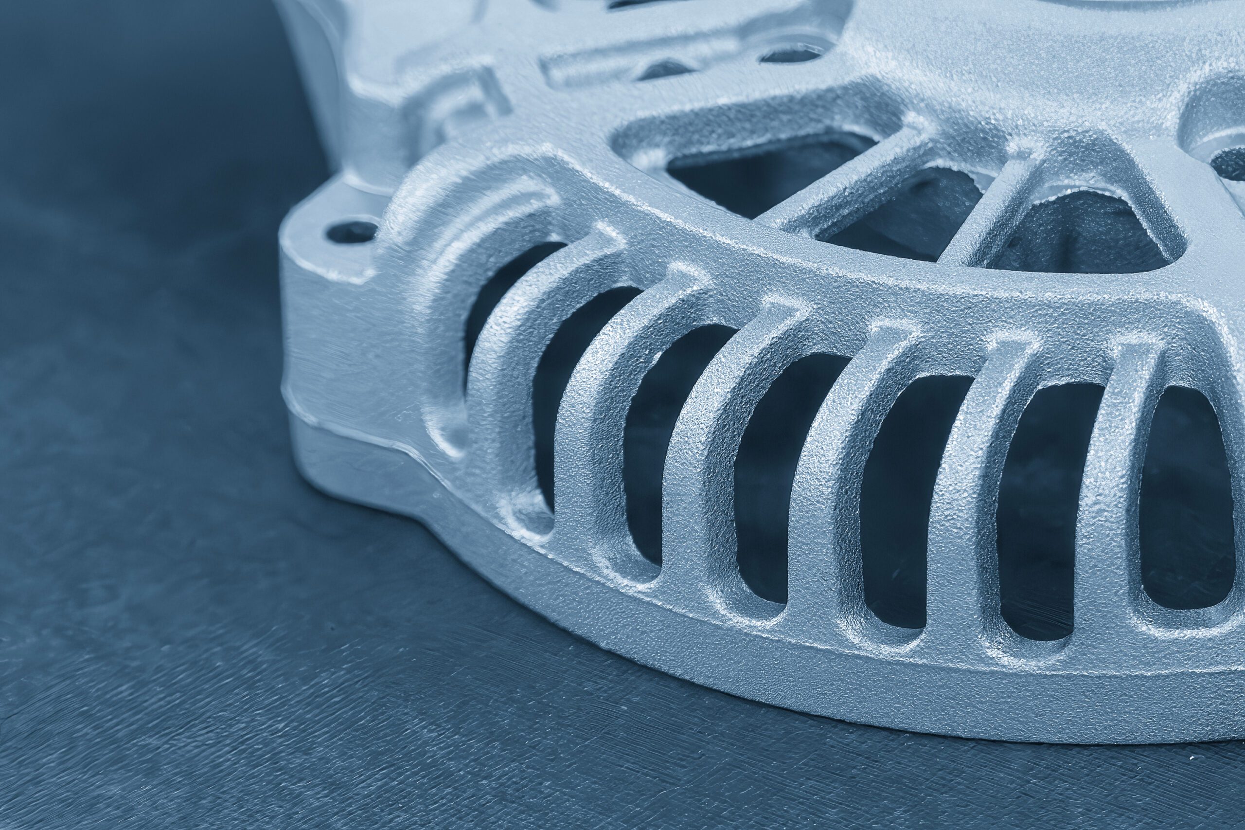 An aluminum casting on a gray background.