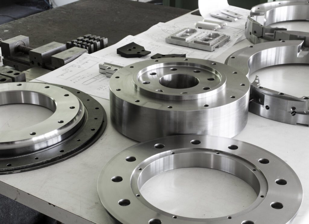 Round metal parts on a table.