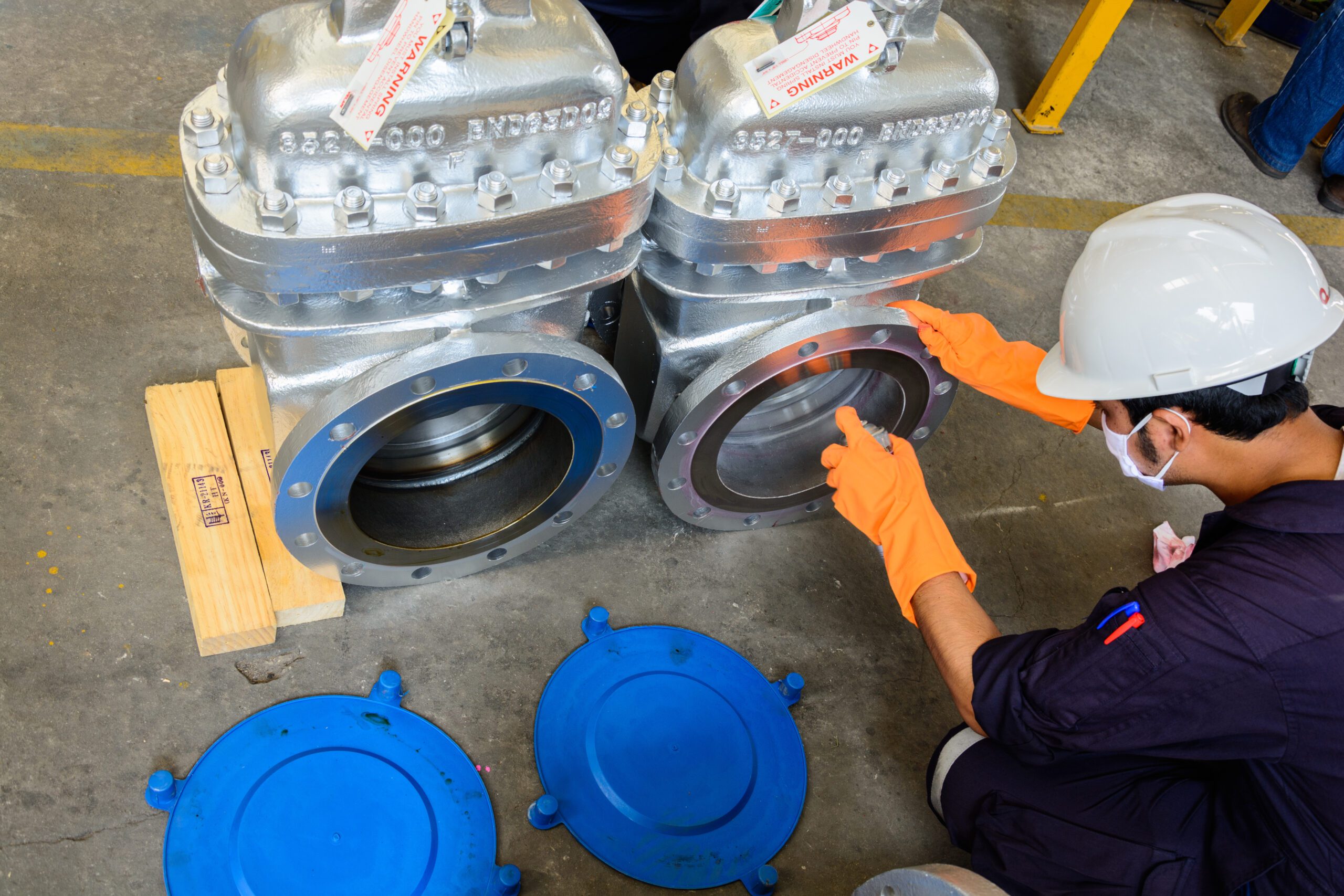 A man conducting a liquid penetrant inspection.
